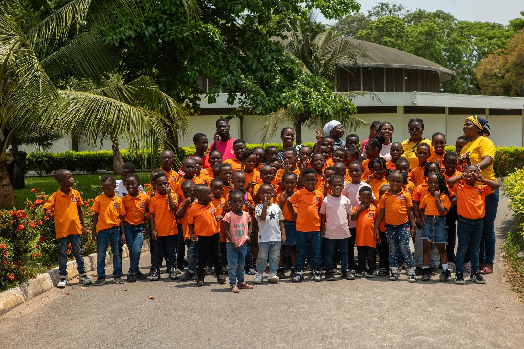Graceland pupils and staff posing together outside the Ghana National Museum