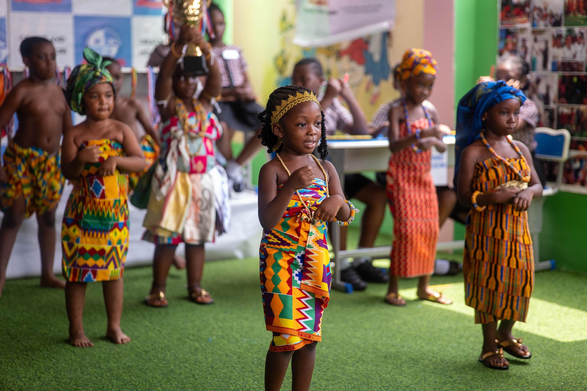 Young Graceland pupils performing a traditional Ghanaian dance in kente cloth